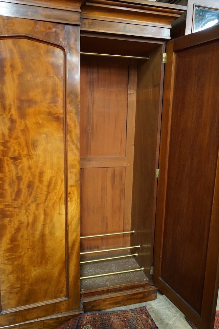 A Victorian mahogany breakfront compactum wardrobe, width 248cm, depth 69cm, height 210cm